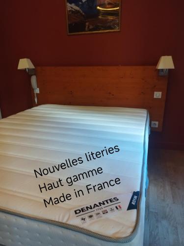 a mattress with a sign on it with the words noveles herbs hair game at hotel les edelweiss in Cauterets
