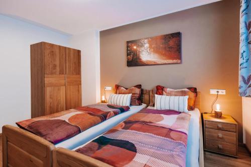 a bedroom with two twin beds and a cabinet at App. Marlos in Leisach