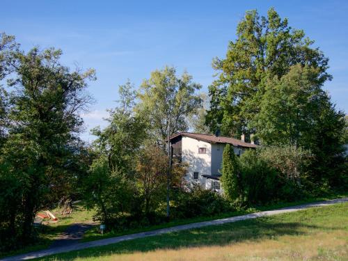 an old house in the middle of trees at Casa Roccolo in Astano