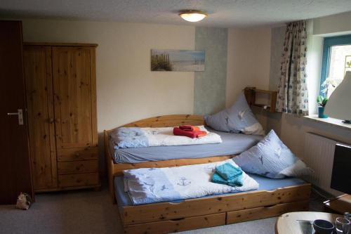 a room with two beds and a couch in it at Ferienwohnung Küssner in Kiel