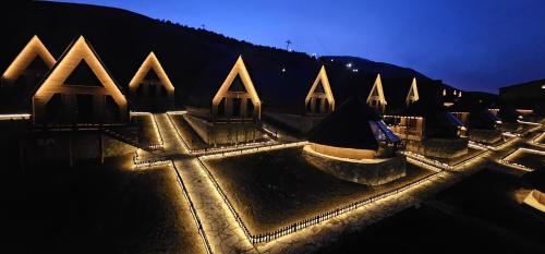 an aerial view of a building at night at Snow Dreams Bungalow Hotel in Türkmenoğlu