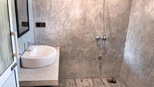 a bathroom with a sink and a shower at Villa Sol in Kamburugamuwa