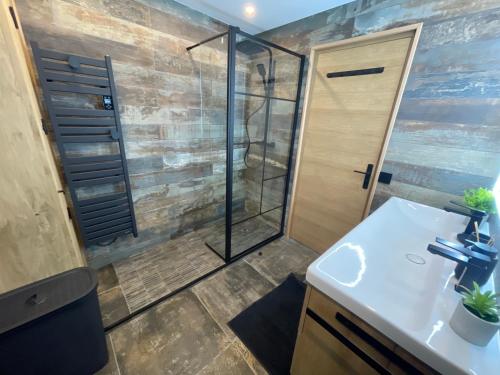 a bathroom with a shower and a sink at Chalet Millou Beuil in Beuil