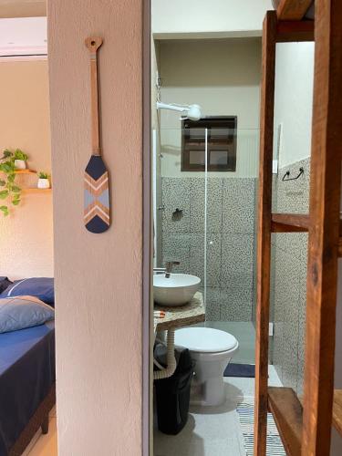 a bathroom with a sink and a toilet in a room at Pouso Clara Mar in Paraty