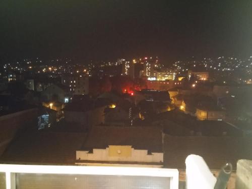 a view of a city at night at Apartman Sweet dreams 1 in Niš