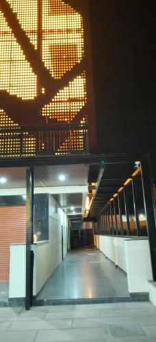 an empty hallway of a building at night at Hangang HOTEL 한강호텔 in Jāmb