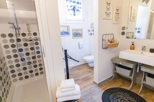 a bathroom with a shower and a toilet and a sink at La Matassina Tuscany in Castellina Marittima