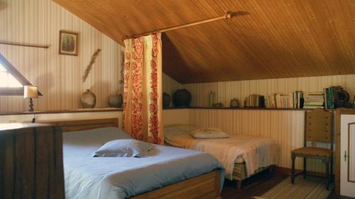 a bedroom with two beds in a room at La boulitte in Asnois