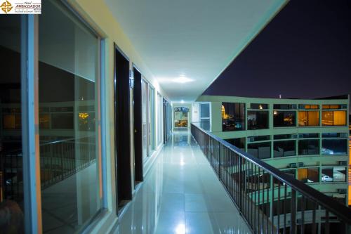 an empty balcony of a building at night at Hotel Ambassador Mérida in Mérida
