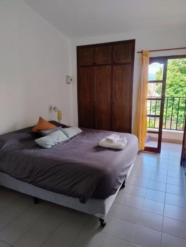 a bedroom with a bed with two pillows on it at Mirador de Nieva in San Salvador de Jujuy