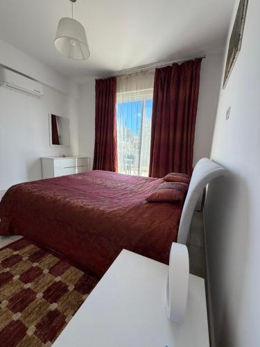 a bedroom with a bed and a window at Tala Rivera Paradise in Tala