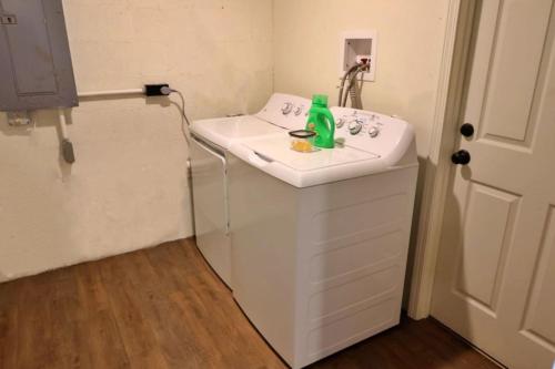 a white bathroom sink with a green bottle on it at The Ridge in Cherokee