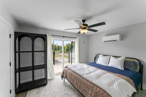 a bedroom with a bed and a ceiling fan at McCormick Retreat in Knoxville