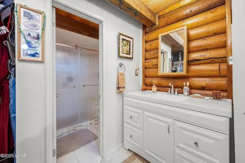 a bathroom with a sink and a shower at Kingman Cabin in Kingman