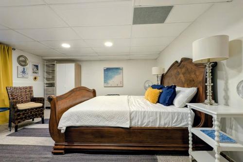 a bedroom with a large bed and a chair at Lawrenceville Escape in Lawrenceville