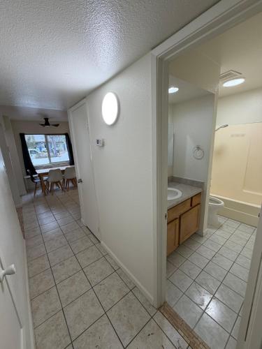 a bathroom with a toilet and a sink at Spring Training Special Comfy 3 Bedroom in Phoenix