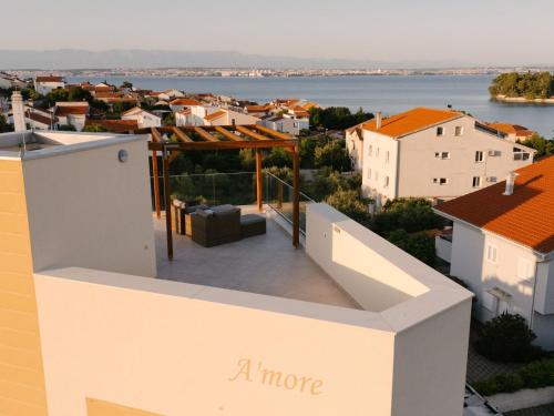 a more apartment balcony with a view of a city at Holiday Home A'more Preko Ferienhaus in Preko Insel Ugljan by Interhome in Preko
