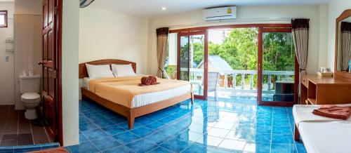 Ένα ή περισσότερα κρεβάτια σε δωμάτιο στο Hugs Guesthouse