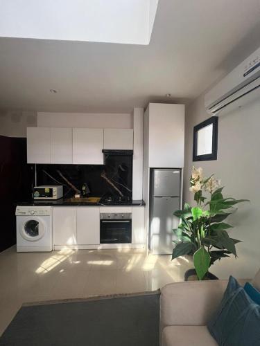 Η κουζίνα ή μικρή κουζίνα στο Duplex Almadies