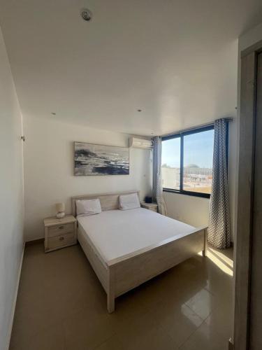 Llit o llits en una habitació de Duplex Almadies