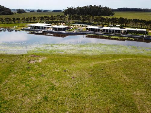 an aerial view of a marina with white buildings at Lomas de San Vicente Hotel Boutique in Balneario Buenos Aires