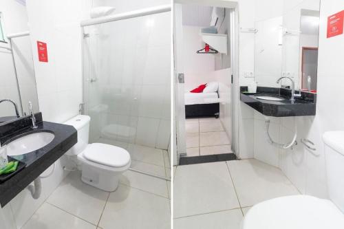 ein Badezimmer mit Toilette, Waschbecken und Dusche in der Unterkunft Alfa Hotel in Nerópolis