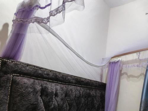 a dress hanging on a wall at Vee Apartment in Mombasa