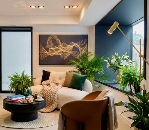 a living room with a couch and a table at Saint Martin by Y3 Hotels, Old Town with Wellness in Poznań