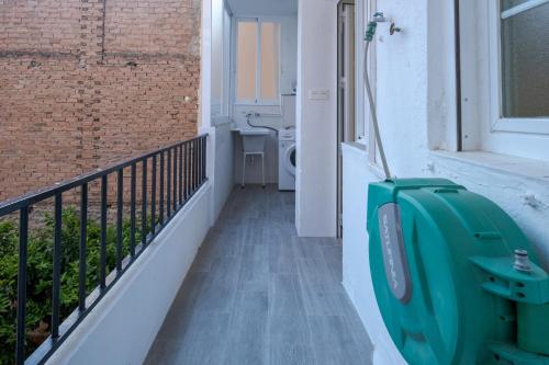 a bathroom with a toilet on a balcony at Piso Moredas in Dúrcal
