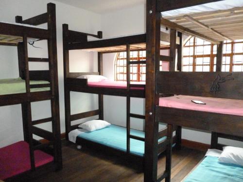 Una cama o camas en una habitación de Hostal CQ Chapinero