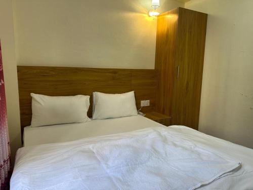 A bed or beds in a room at none star