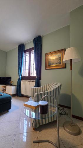 a living room with a couch and a table at Al Melograno - Villetta - Gussago - Franciacorta in Gussago
