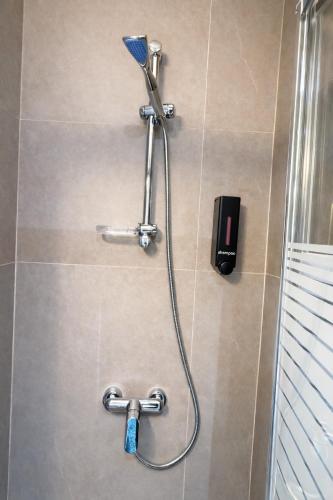 a shower in a bathroom with a shower head at Smart Comfort Deluxe N1 private Balcony Bathroom Beach 250m Marina Port 800m in Limassol