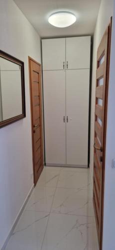 an empty room with two closets and a mirror at JULIANNA APARTMAN Budapest FREE PARKING in Budapest