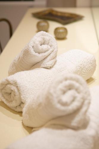two towels sitting on top of a table at Luxury and Cozy Chios in Chios