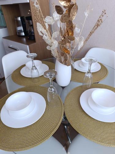 a table with three white plates on top of it at The harmony suit in San Antonio