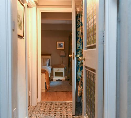 an open door to a bedroom with a bed at No6 @ Globe Lane,Alston in Alston