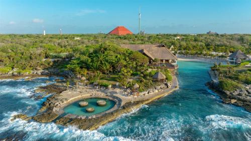 an aerial view of a resort in the ocean at Occidental at Xcaret Destination - All Inclusive in Playa del Carmen