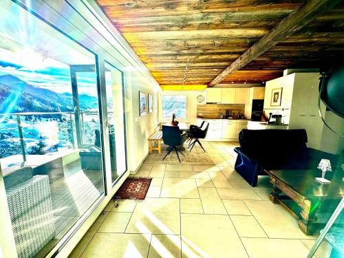 a living room with a view of a mountain at Mountain View in Andermatt