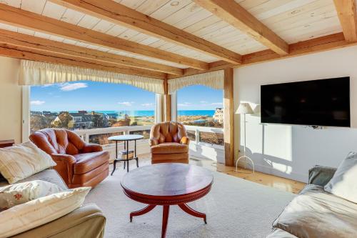 a living room with a view of the ocean at Oceanaire in Dennis