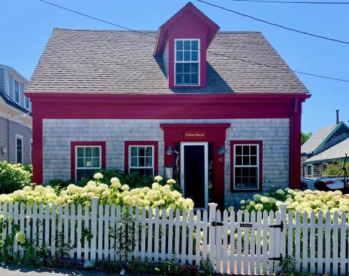 a small house with a white picket fence at The Cook House in Provincetown