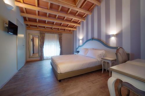Voodi või voodid majutusasutuse Fracanzana Hotel toas