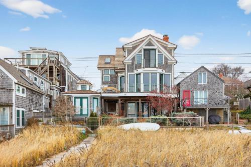 a large house in the middle of a city at The Grand On Commercial in Provincetown