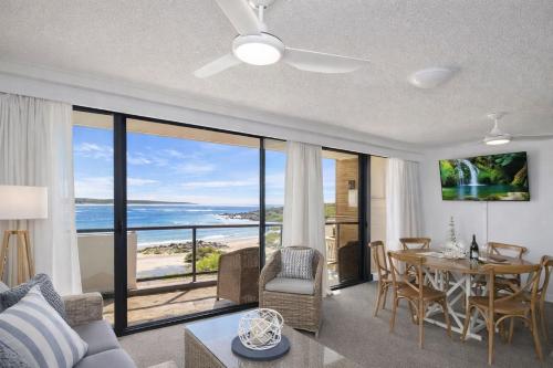 a living room with a view of the ocean at Beachside Bliss in Port Macquarie