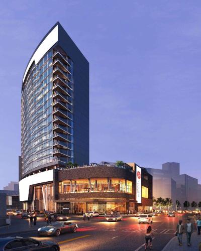 a large building with cars parked in front of a street at Hotel Phoenix Atlanta in Atlanta