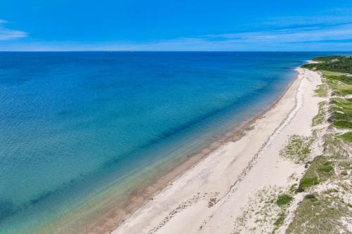 an aerial view of a beach and the ocean at Le Petit Château in Dennis