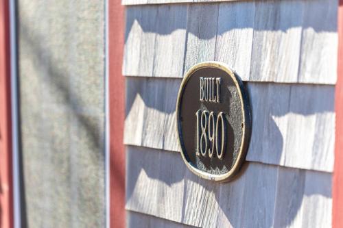 a sign on the side of a house at The Cook House in Provincetown