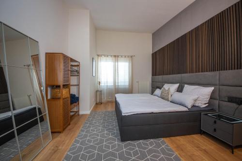 a small bedroom with a bed and a window at Modern Luxury Villa Antonia in Mössingen
