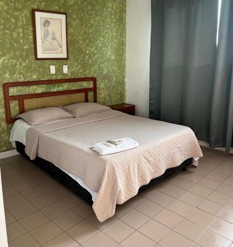a bedroom with a large bed in a room at Hotel Santa Barbara in Arauca