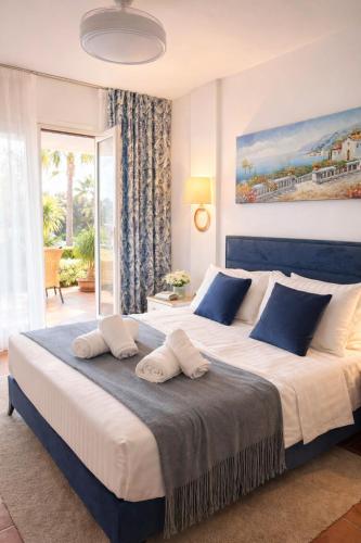 a bedroom with a large bed with two pillows on it at Casa de Andres Mojácar in Mojácar